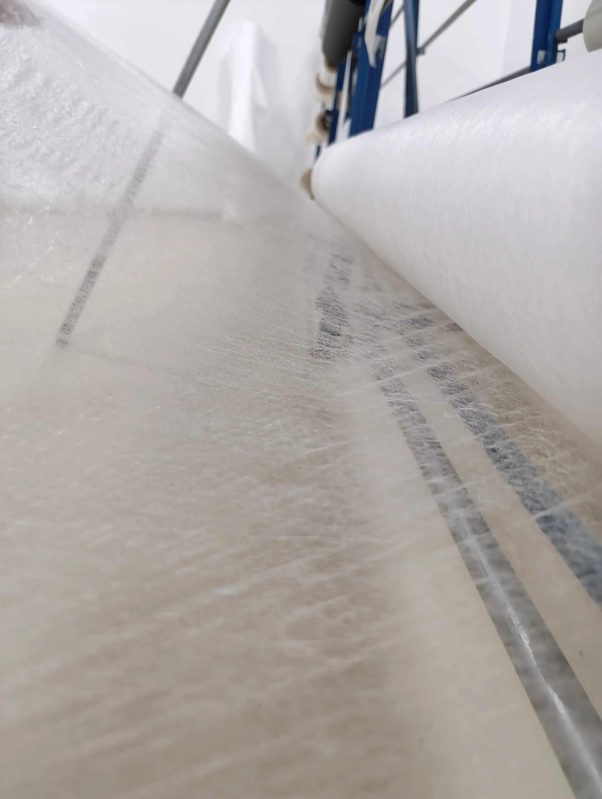 Hot melt adhesive mesh web for leather