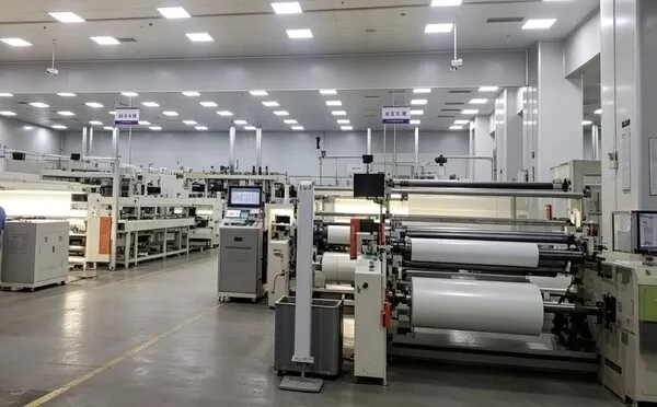 Automated hot melt adhesive film production facility for industrial supply.