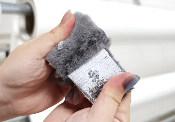 Testing the bonding of velcro loop fabric to needle-punch automotive carpet