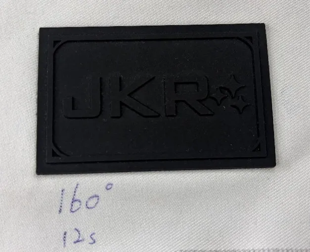 PVC patch bonding test on Oxford fabric using hot melt adhesive film.