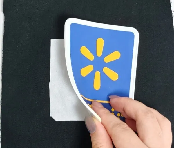 Pre-lamination process of applying hot melt adhesive film to the PVC patch.