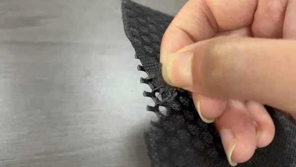 15 g/m² PES hot melt adhesive web pull test on nonwoven fabric bonded to a speaker honeycomb panel