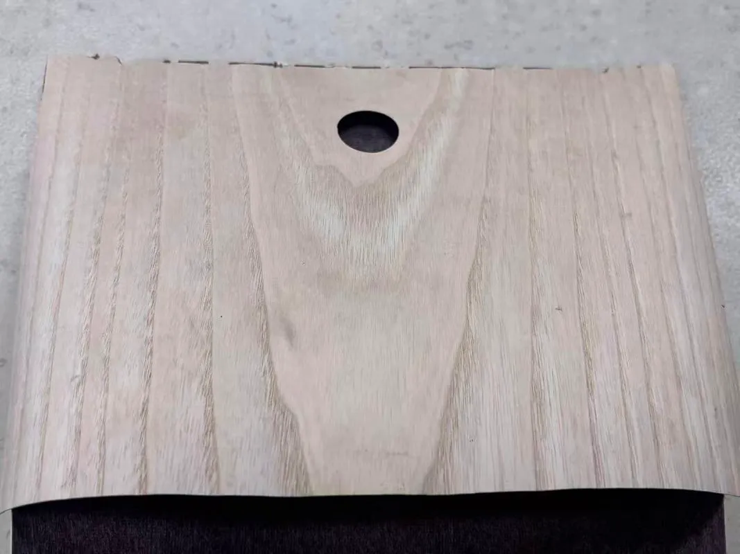 VOMELT sample showing natural wood veneer bonded to an MDF substrate using EVA hot melt adhesive web